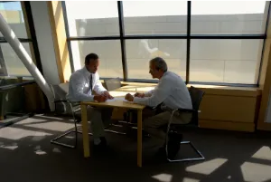 client and consultant meeting at a table